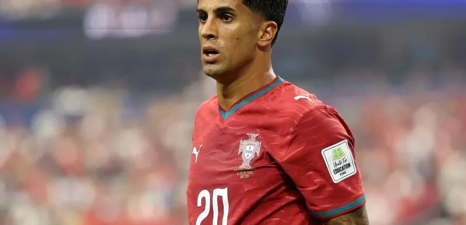 Player wearing red Portugal jersey on field