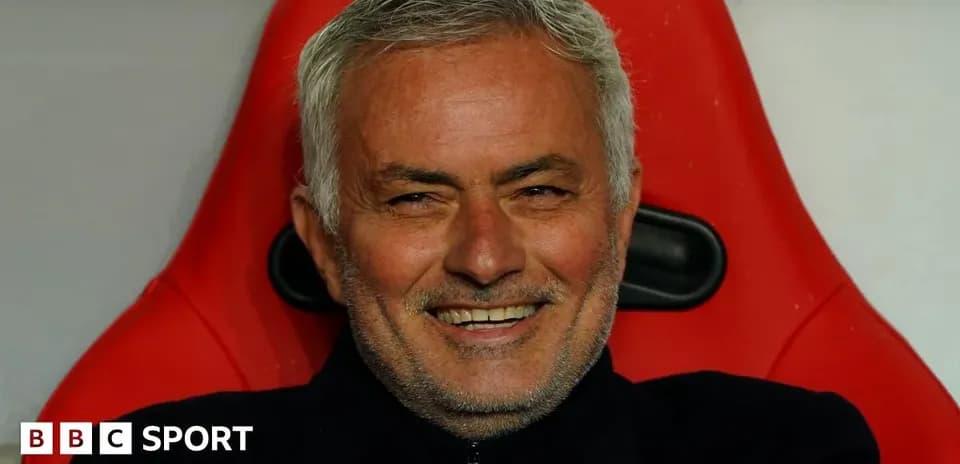 Manager seated on the bench during a match