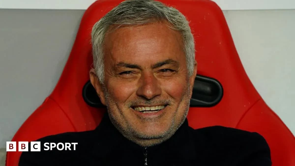 Manager seated on the bench during a match