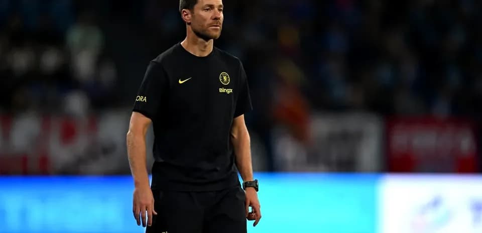 Coach walking on the field during a match