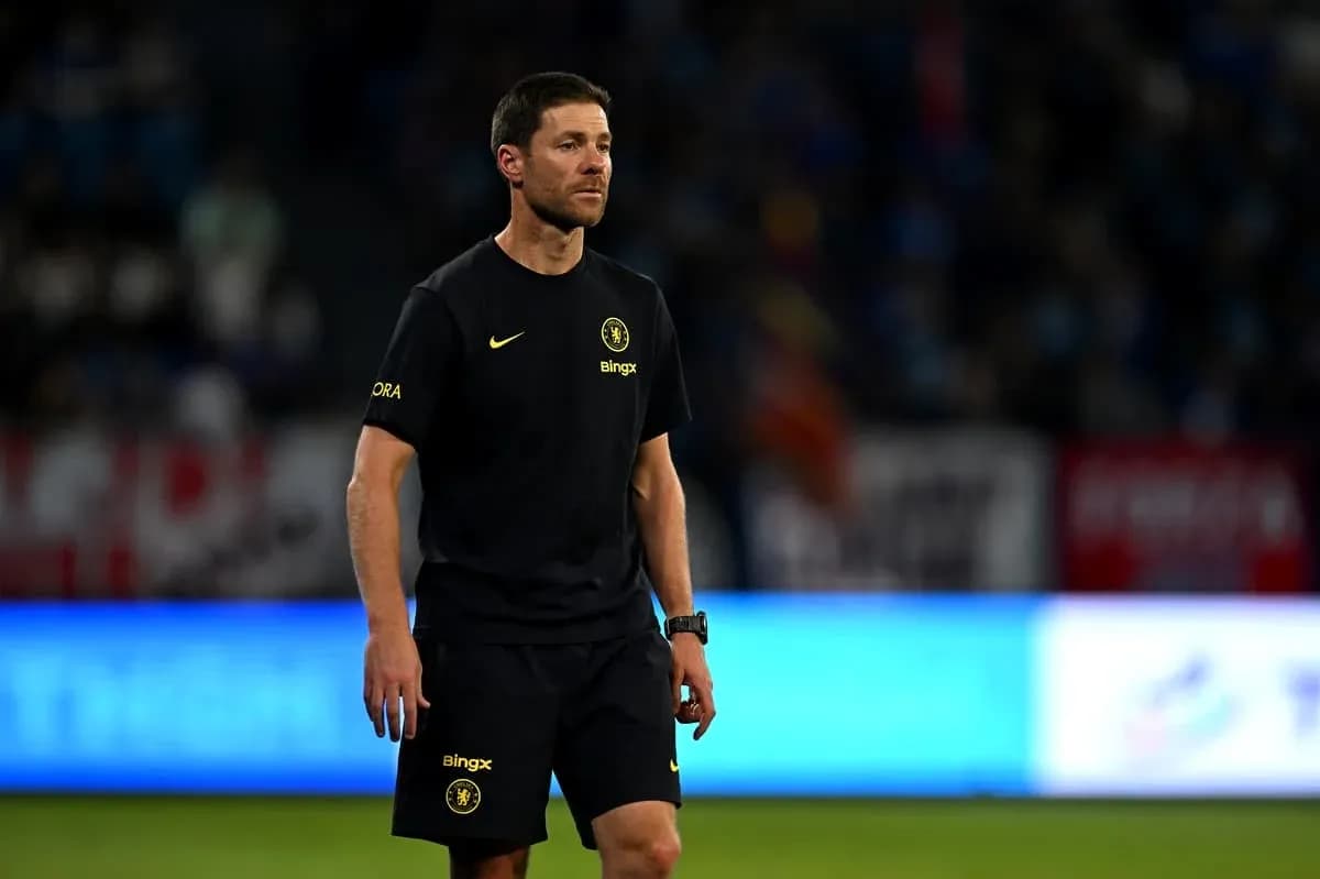 Coach walking on the field during a match