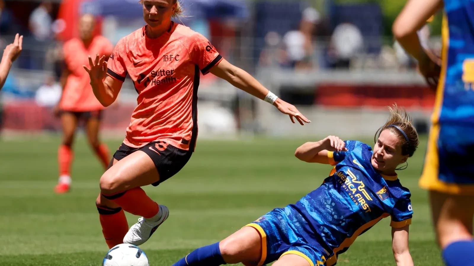 Bay FC player challenging Utah Royals opponent
