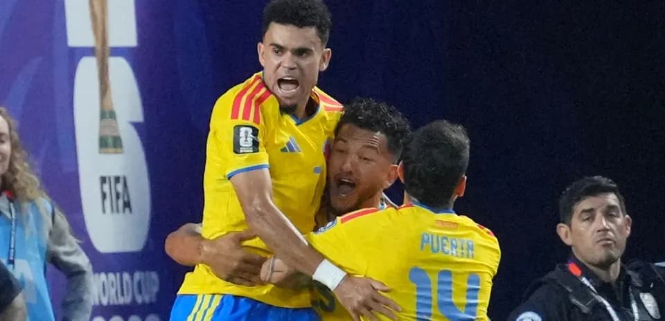Players celebrating a goal during FIFA match