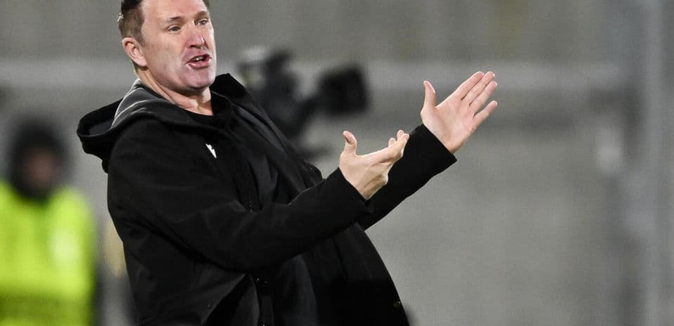 Coach gesturing during match from the sidelines