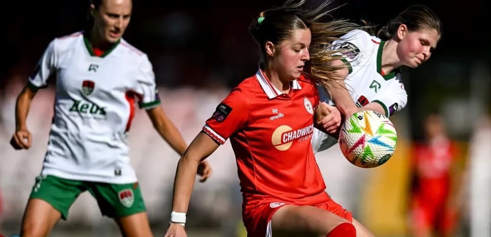 Two players competing for the ball in a match