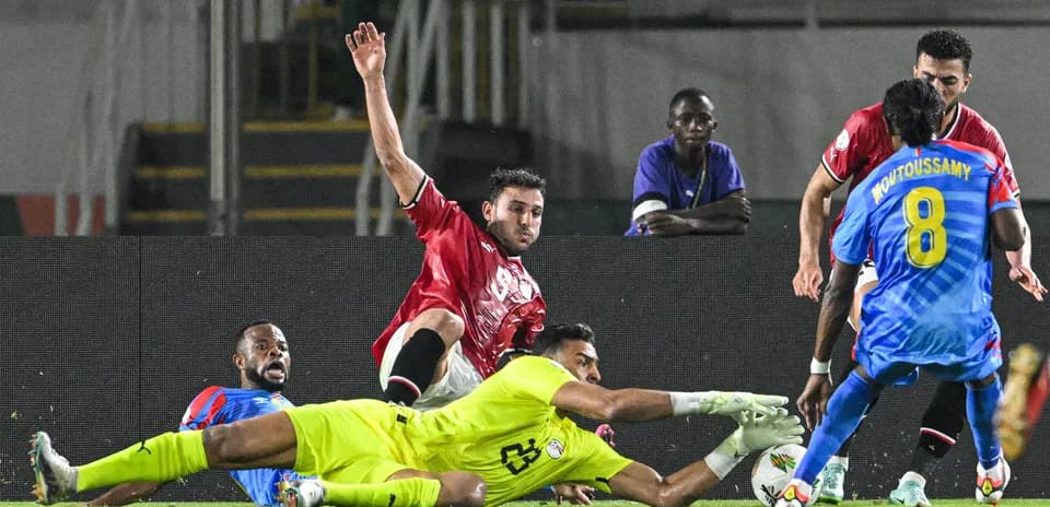 Players contesting for the ball near the goal