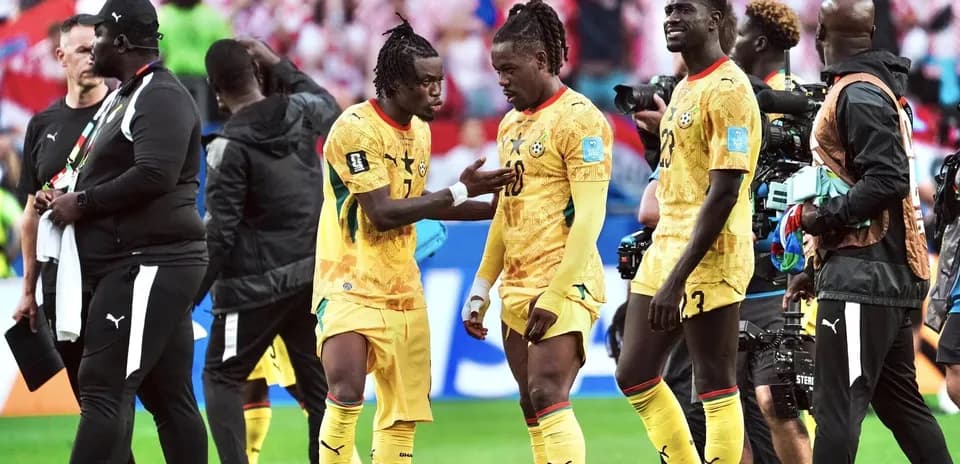 Ghana players discussing on the pitch after match