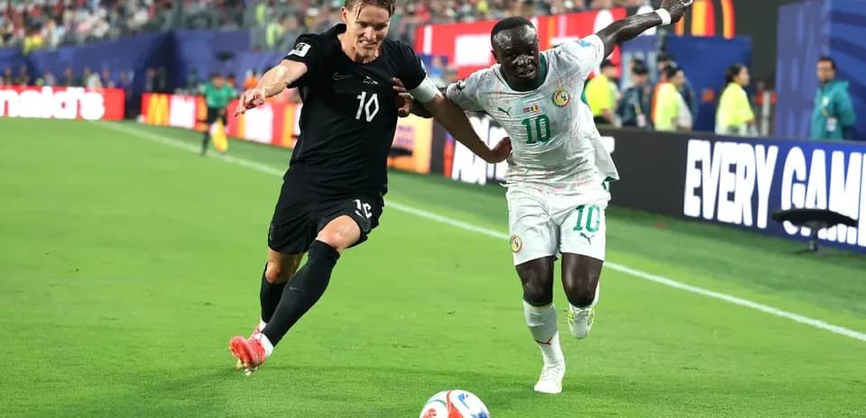 Two players contesting for the ball during match