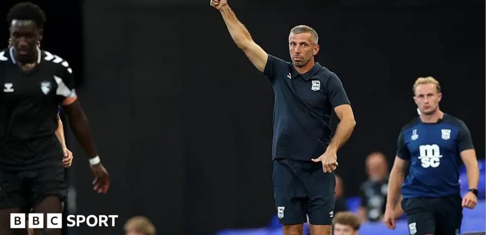 Coach directing players during training session