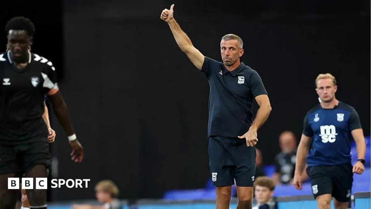 Coach directing players during training session