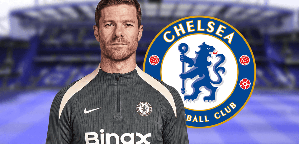 Chelsea FC coach posing with club logo backdrop