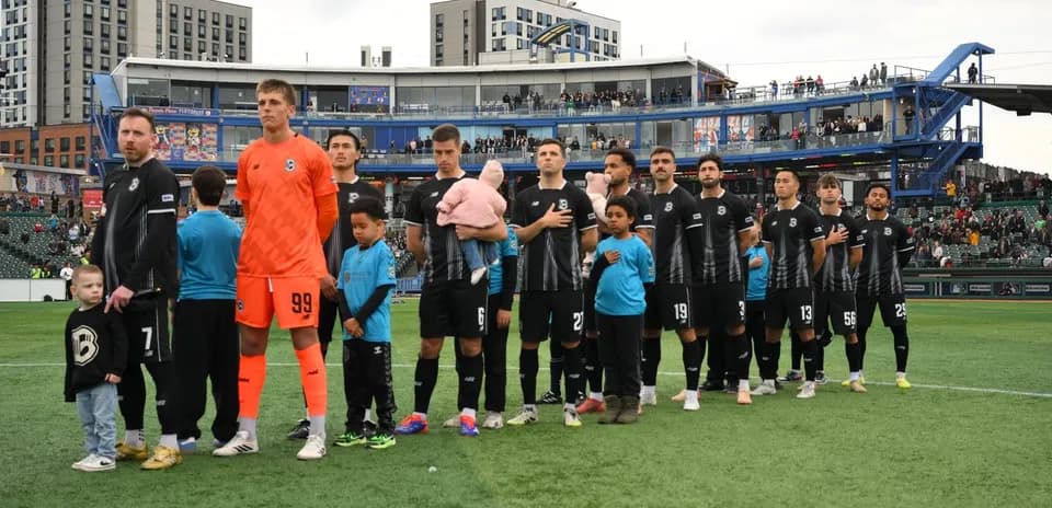 Players and children during national anthem ceremony