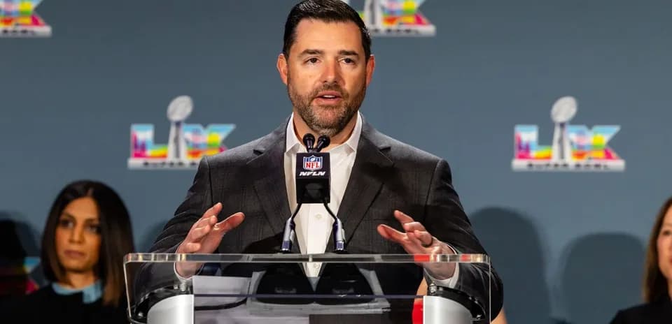 Speaker at podium during NFL press conference