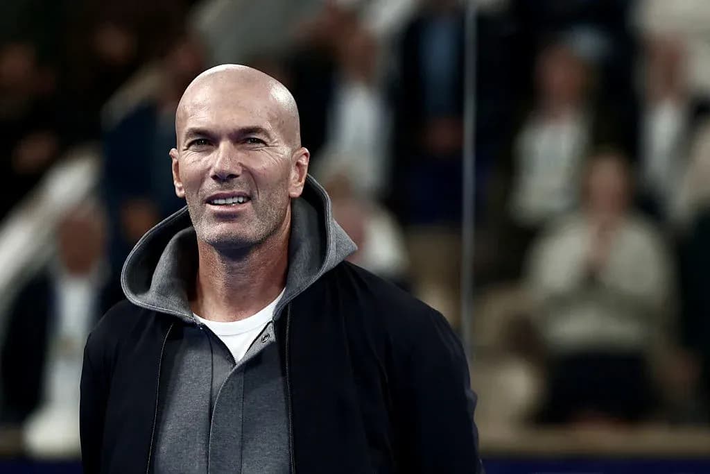 Man smiling in a casual outfit at event