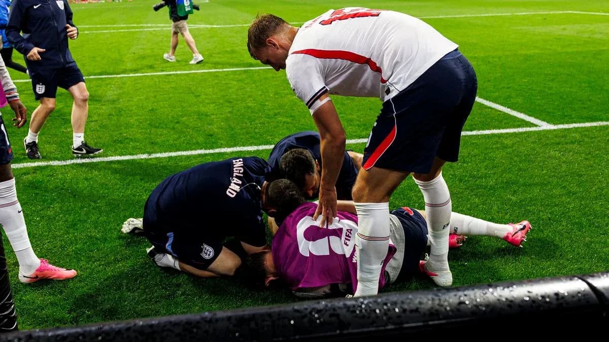 Players attending to an injured teammate on field