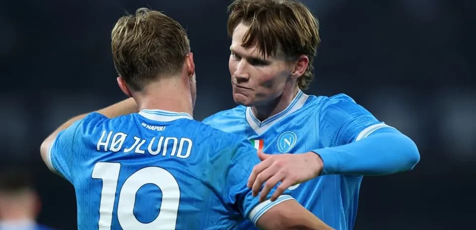 Two Napoli players celebrating during a match