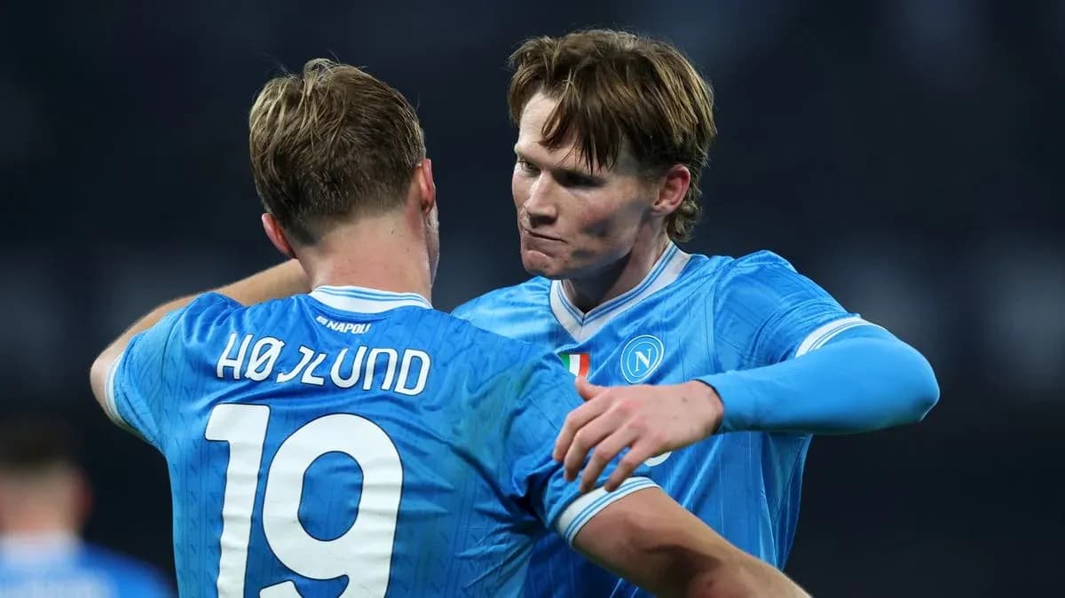 Two Napoli players celebrating during a match