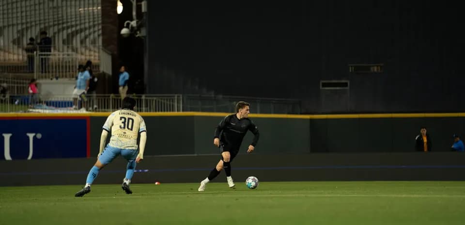 Player dribbling the ball during match action