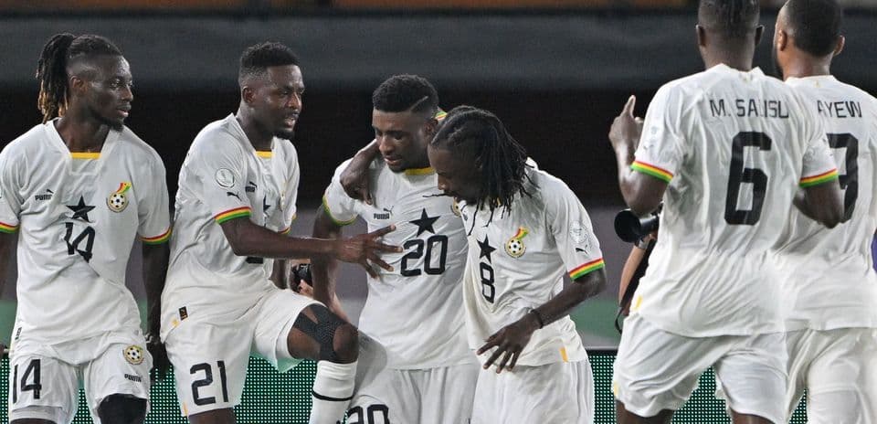 Ghana players celebrating a goal during a match