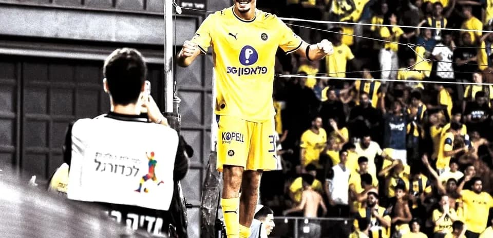 Player celebrating with fans during match