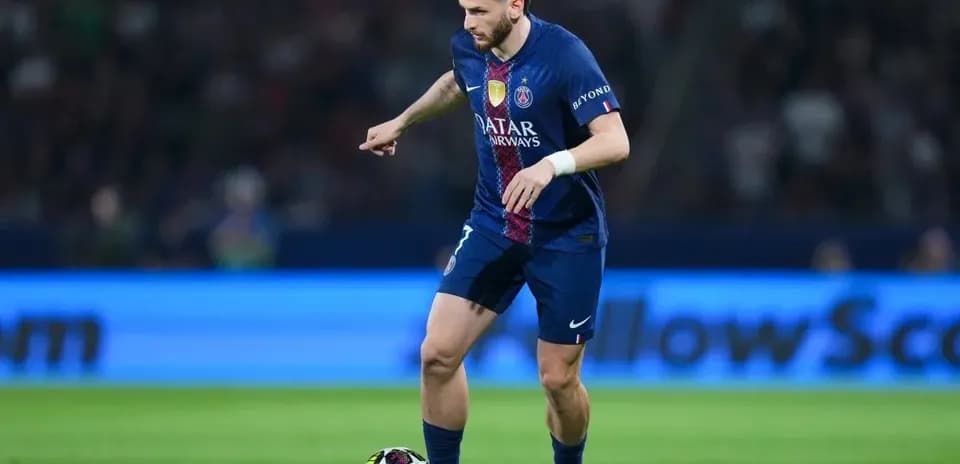 Player dribbling the ball on the pitch