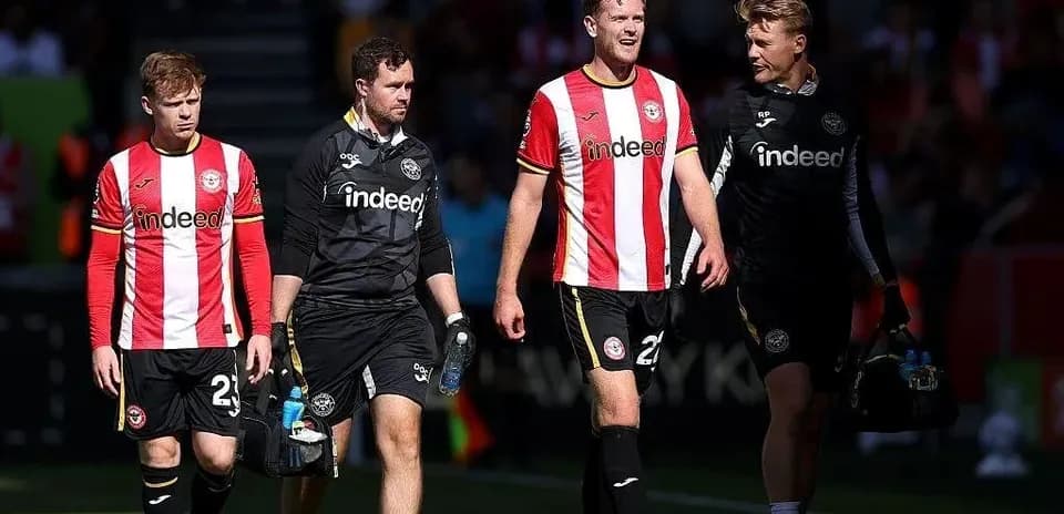 Brentford players walking off the pitch together