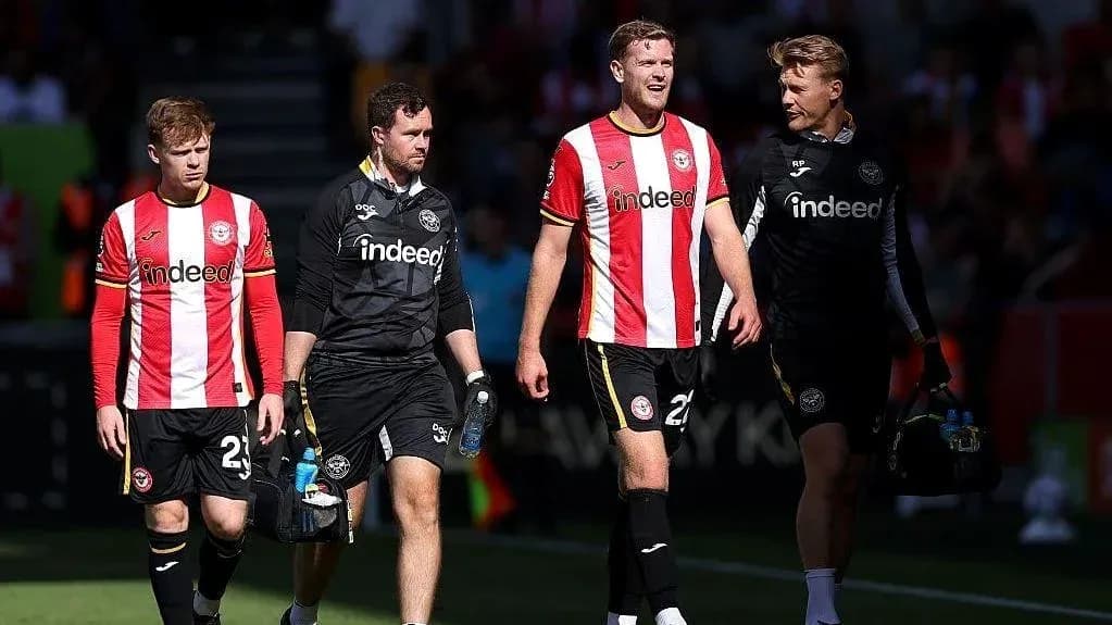 Brentford players walking off the pitch together