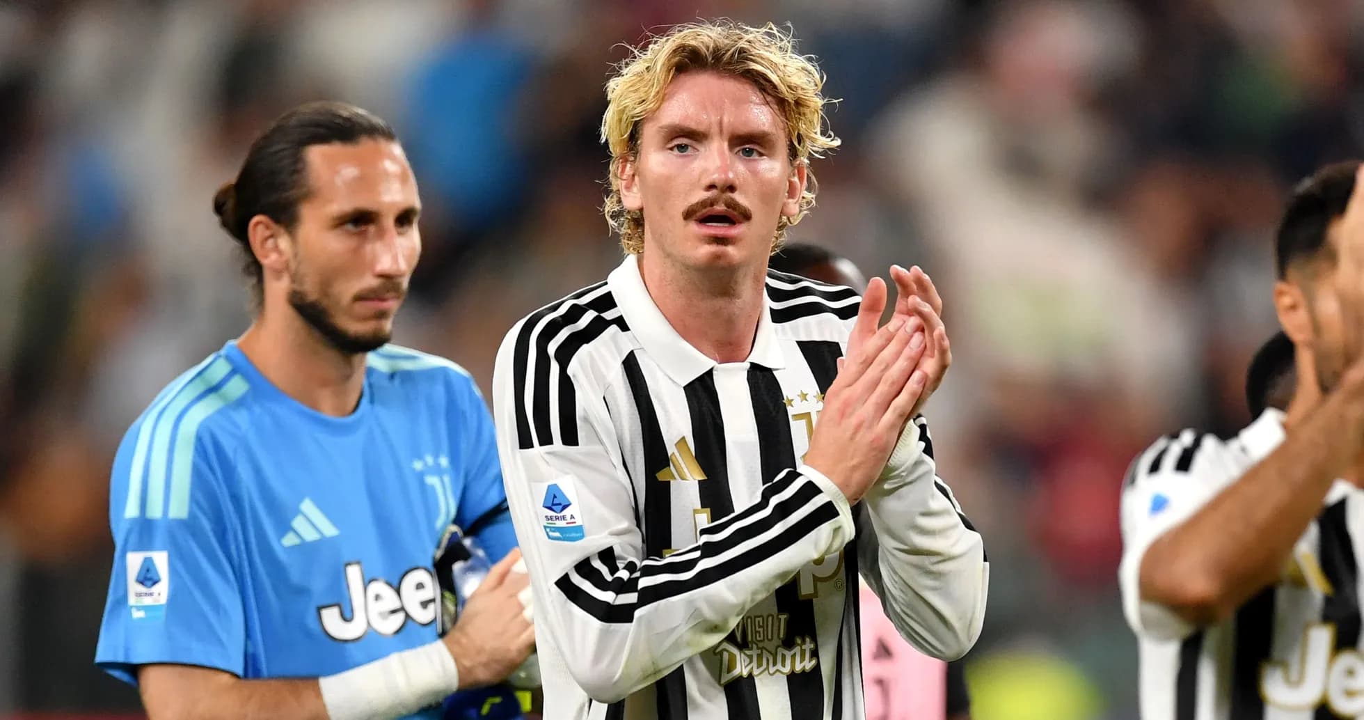 Juventus players applauding fans after match