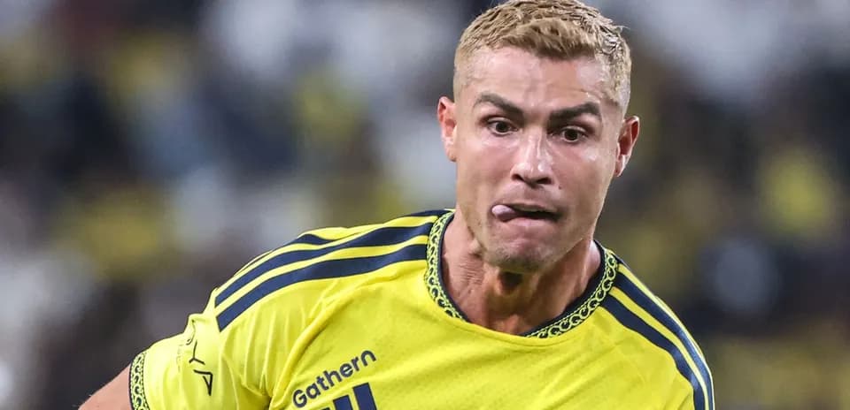 Player in yellow kit running during a match