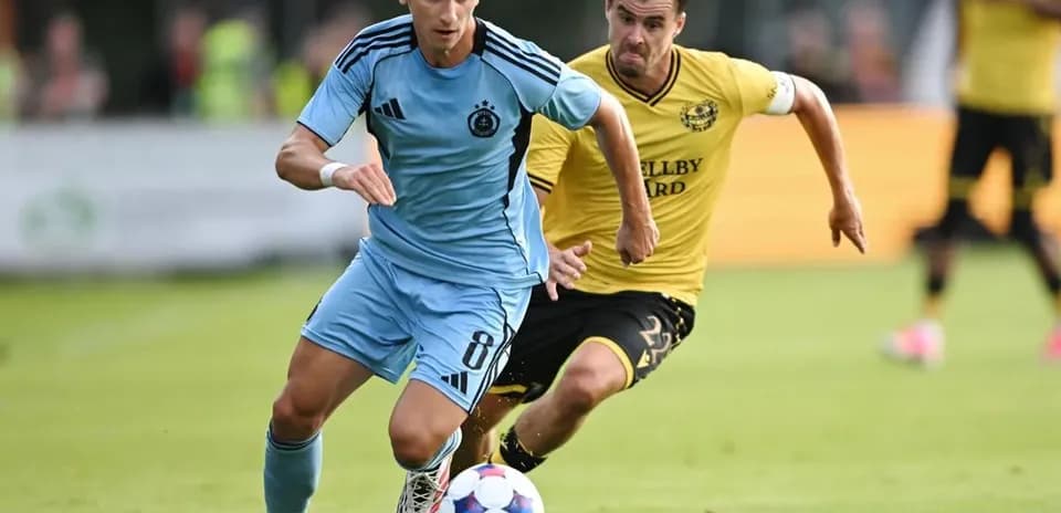 Player dribbling the ball in UEFA match
