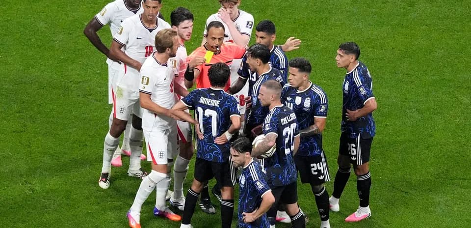 Players discussing with referee during England vs Argentina match