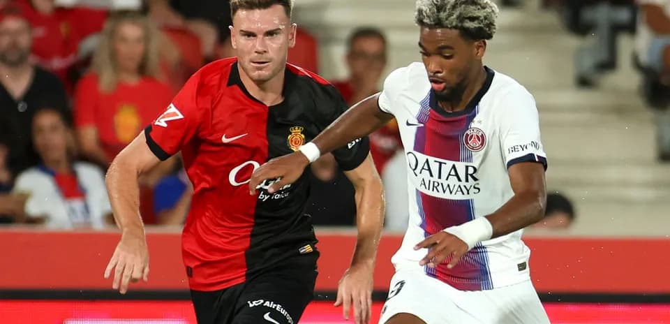 Two players competing for the ball during match