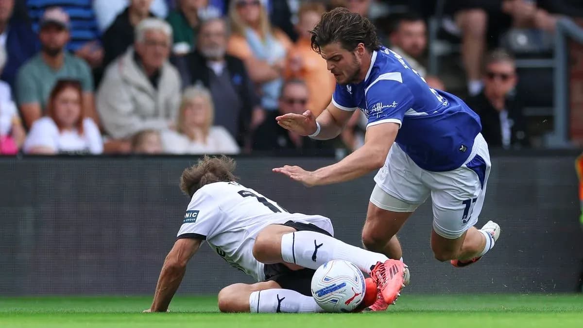 Player tackling opponent during a football match