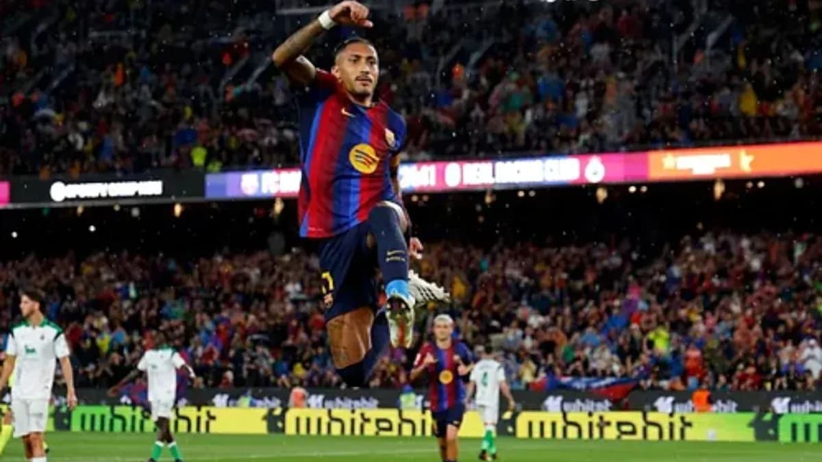 Player celebrating a goal at FC Barcelona stadium