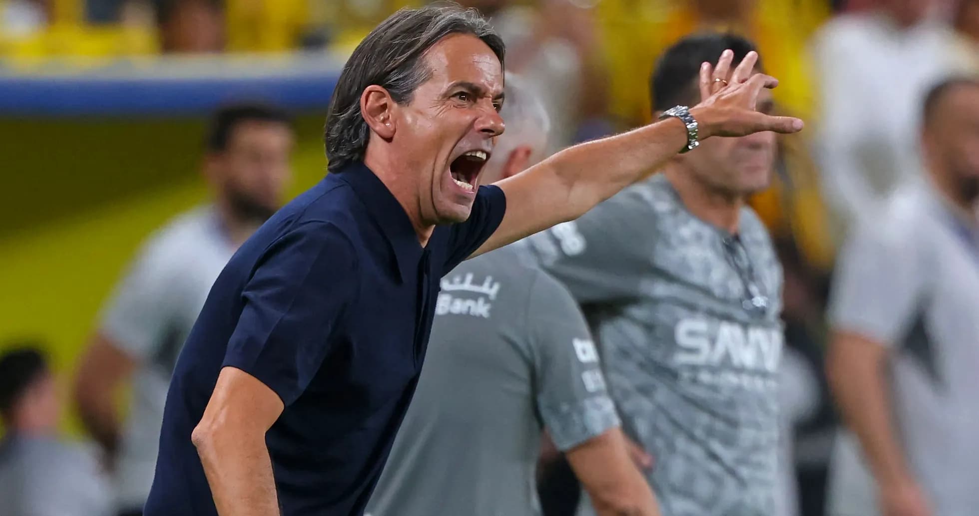 Coach directing players during a match from sidelines