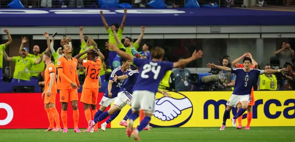Japan celebrating a goal against Netherlands