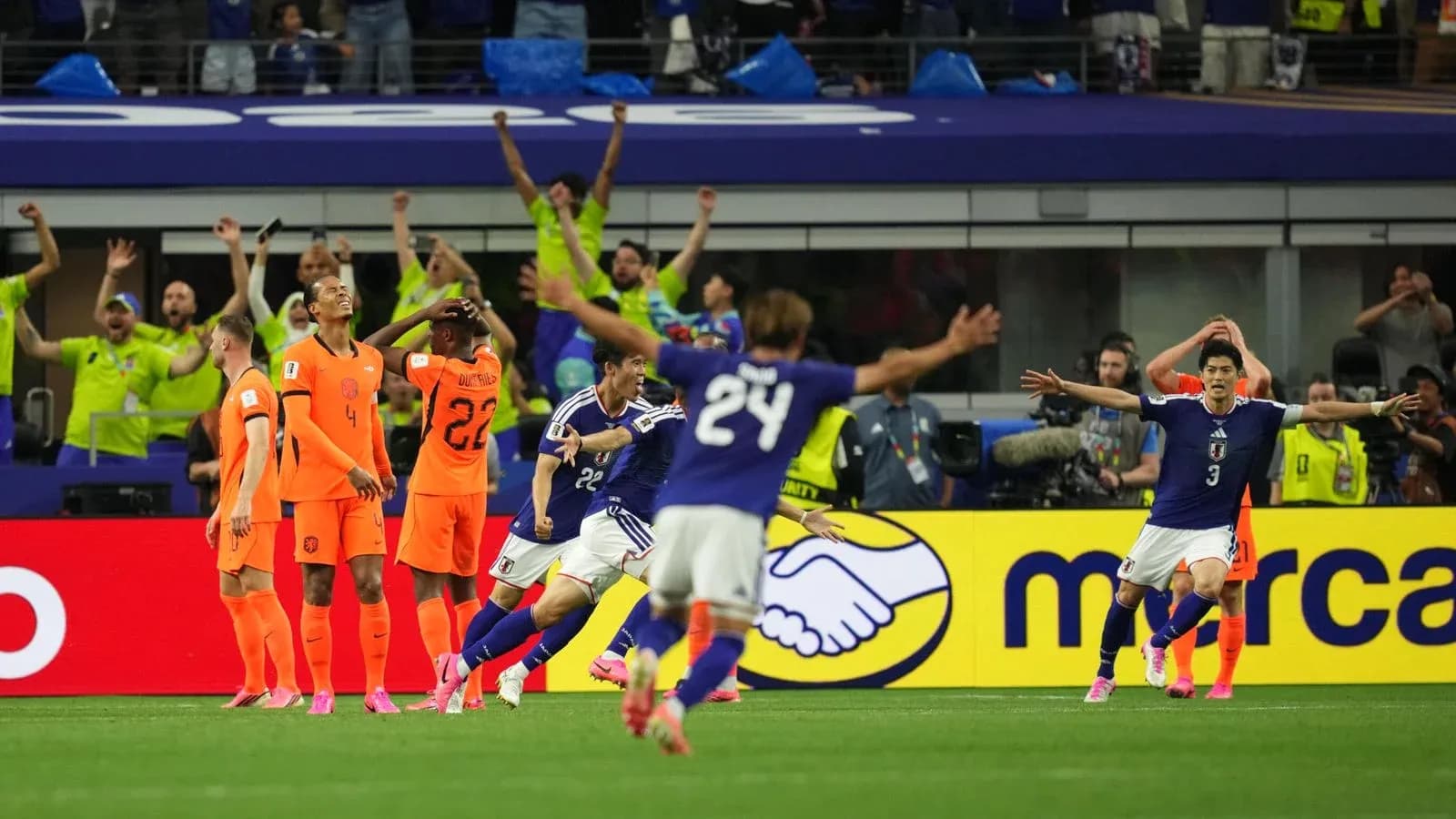 Japan celebrating a goal against Netherlands