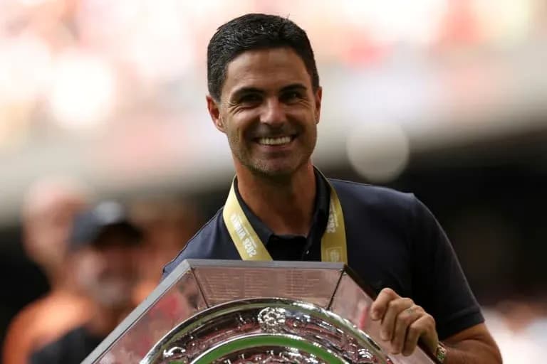 Coach holding trophy during victory celebration