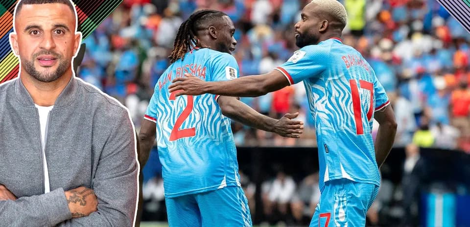 Two players celebrating on the field during match