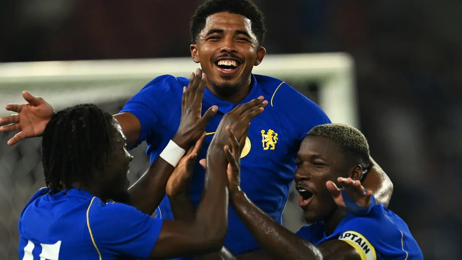 Players celebrating a goal during a match