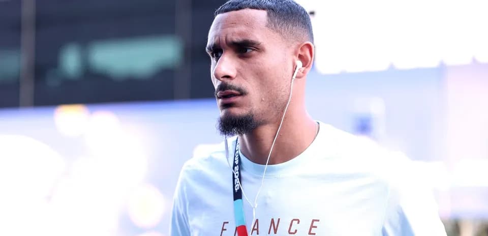 Player wearing headphones walking towards venue