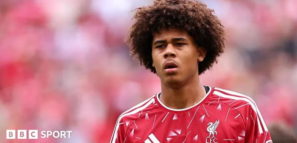 Young player in Liverpool FC jersey during match