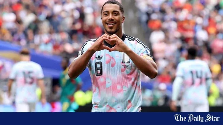 Player celebrating with heart gesture during match