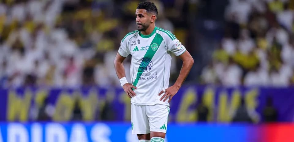 Player standing with hands on hips during match