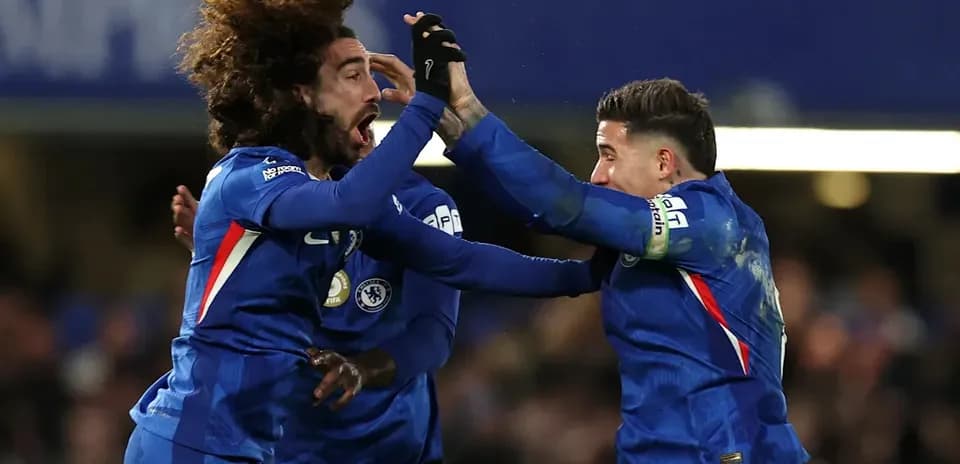 Chelsea players celebrating a goal on the pitch