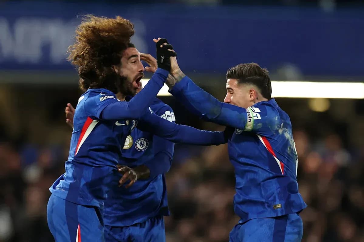 Chelsea players celebrating a goal on the pitch