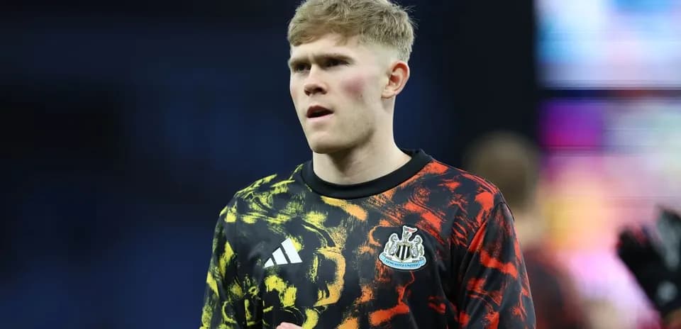 Newcastle United player in colorful warm-up kit