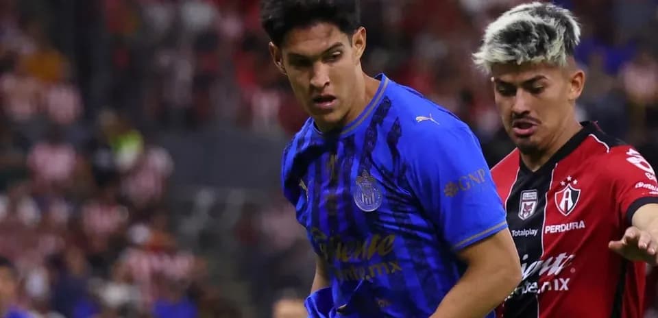 Two players competing in Liga MX match