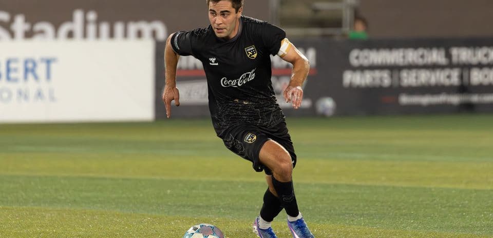 Player running with the ball during match