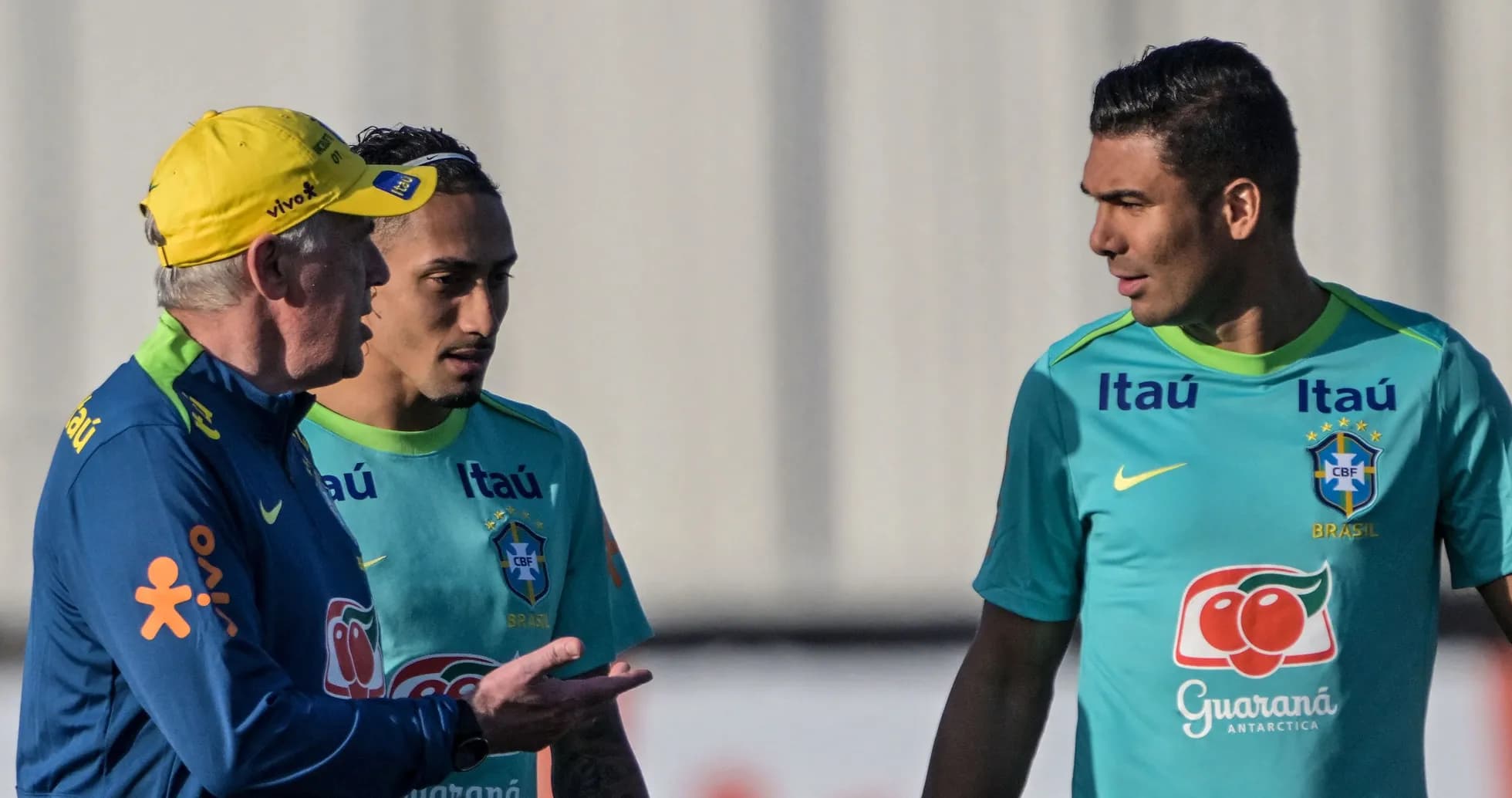 Coach discussing with players during training session